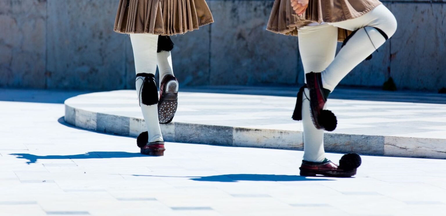 Traditional Greek guards performing ceremonial march
